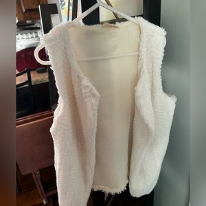 Adorable girls white fuzzy vest.